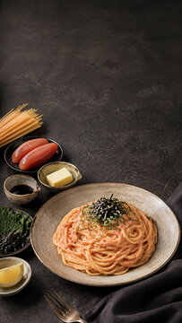 Vertical Mentaiko Pasta with Cod Roe, Butter and Nori Ingredients on Dark Slate