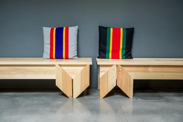 Abstract composition with two wooden benches and colorful pillows © BOOCYS