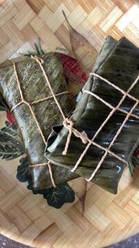 Traditional hallacas wrapped in leaves top view Latin food