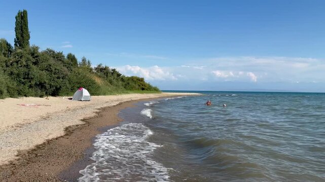 Shore of the Issyk Kul lake on sunny day Kyrgyzstan