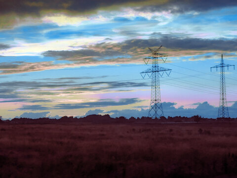 high voltage power lines in sunset