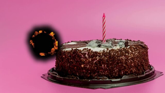 Birthday cake with candle and special effects at celebration