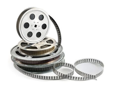 Stack of Metal Film Spools and Unrolled Analog Movie Strip Isolated on Clean White Background