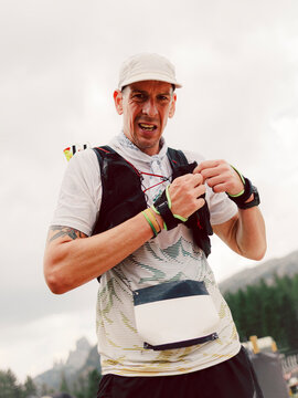 Portrait of a trail athlete during the race across a mountain 
