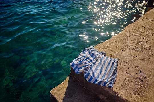 Swim Trunks Resting on a Stone Edge