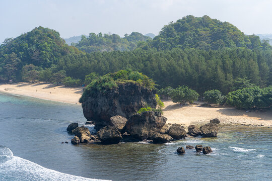 A vast expanse of rocky outcrops viewed from the clifftop at Tanjung Penyu, Malang.