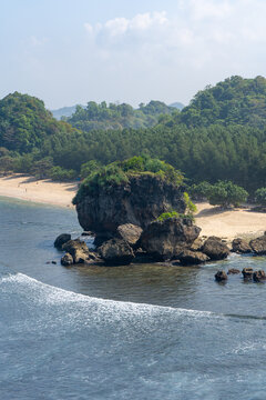 A vast expanse of rocky outcrops viewed from the clifftop at Tanjung Penyu, Malang.