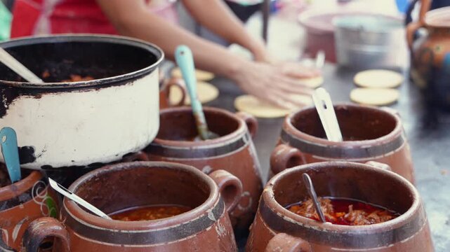 Mexican street food vendor preparing tacos