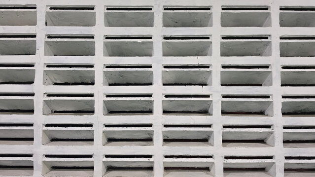Decorative ventilation blocks arranged in a geometric wall pattern, providing natural airflow, light filtration, privacy, and architectural detail for residential and commercial building design