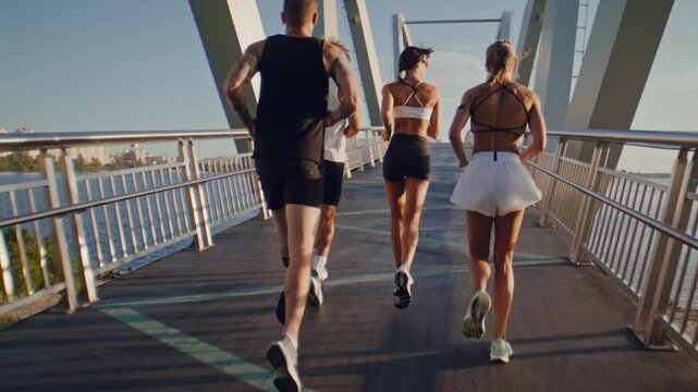 Adaptive man runner joins group workout along pedestrian bridge