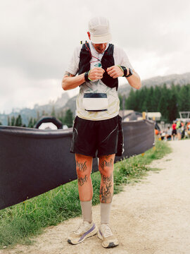 Portrait of a trail athlete during the race across a mountain 
