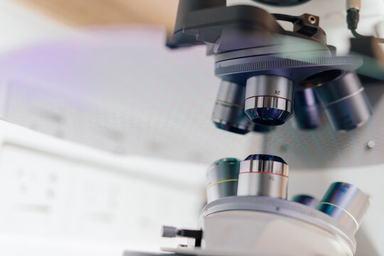 Laboratory Scene Showing Microscope Focusing on a Silicon Wafer