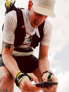 Portrait of a trail athlete during the race across a mountain 