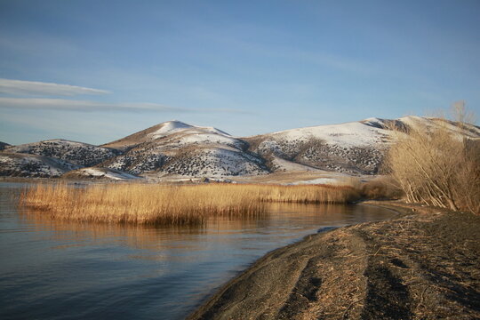 Lake Sevan in Winter with Snow-Covered Mountains and Reeds, Armenia