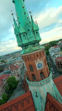 Agile flight around St. Joseph's Church and over Podgorski Square in Cracow