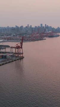 Aerial view of Port of Vancouver, harbour and mountains on the background