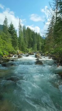 Flight over a mountain river. Shot on FPV drone. Tatra Mountains, Slovakia.