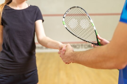 Squash players shaking hands before the match