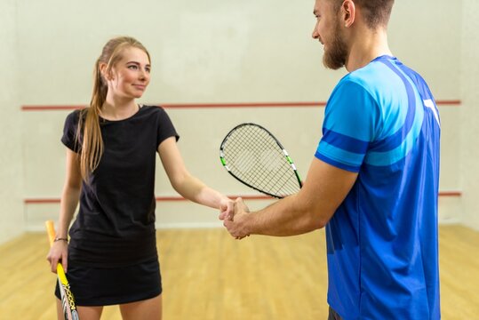 Squash players shaking hands before the match