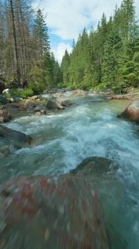 Flight over a mountain river. Shot on FPV drone. Tatra Mountains, Slovakia.