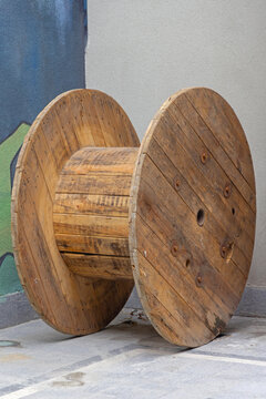 Large Empty Spool Wooden Cable Reel Drum at Construction Site
