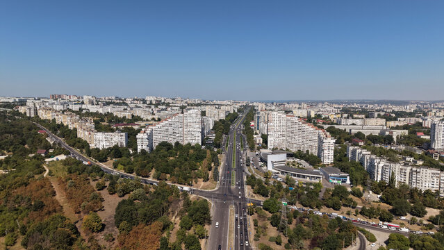 Aerial view of the iconic City Gates residential buildings and Dacia Boulevard in Chisinau, Moldova, with traffic, apartment blocks and the urban landscape of the Botanica district.