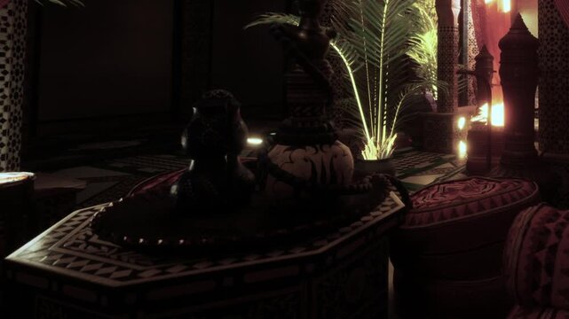 This scene features a Moroccan interior with traditional items and palm plants. Soft lighting highlights decorative elements and creates a warm atmosphere. Guests might enjoy tea here.
