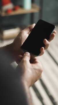Close up of hand plugging and unplugging USB C cable into smartphone vertical video