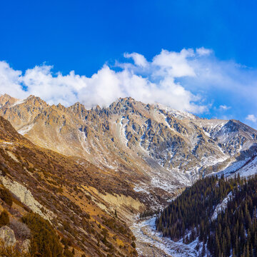 Rugged Mountain Landscape in Kyrgyzstan Under Blue Sky