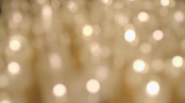 Group of lit candles, out of focus