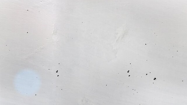 Seamless 4K looping vertical movement across a smooth white painted wall with subtle texture and clean minimalist appearance. Perfect for presentations and modern motion graphics.
