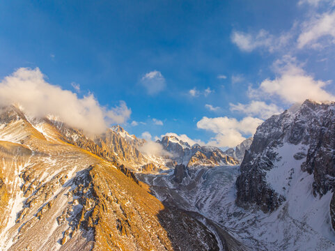 Majestic Mountain Range with Glacier Under Clear Blue Sky