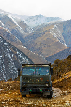 Rugged Truck on Dusty Mountain Road in Kyrgyzstan