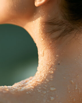 Water droplets on neck and ear close up hydration
