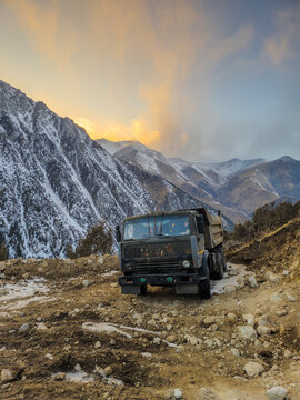 Heavy-Duty Dump Truck on Rocky Mountain Road in Kyrgyzstan