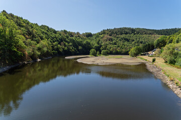 Fototapeta premium Low water level and exposed shoreline during summer drought in Germany
