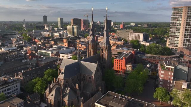 Eindhoven City in the Netherlands. Aerial Drone View City Center with Modern Buildings and Historical Catherines Church