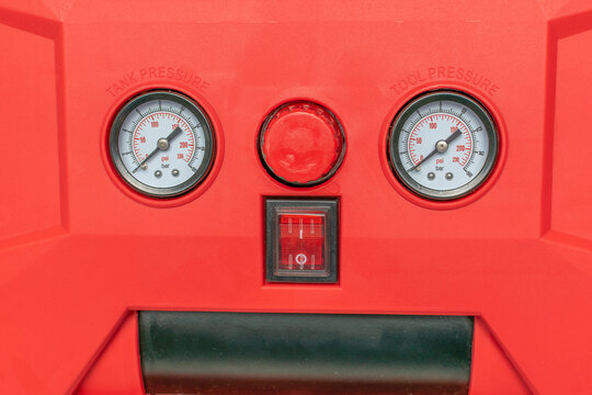 Red Air Compressor Control Panel with Pressure Gauges and Button Display