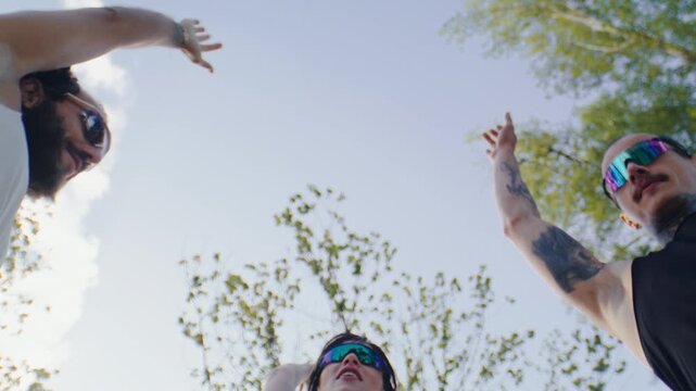 Running team stacks hands together after outdoor park workout