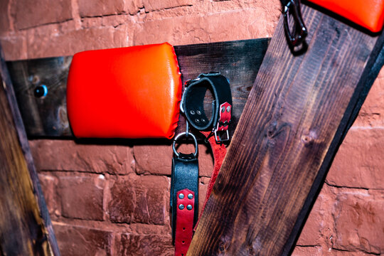 SM cross or Andreaskreuz is used in the BDSM scene on red background