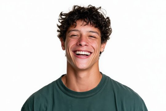 Portrait of a cheerful young man on a white studio backdrop