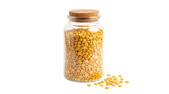 Yellow split peas in glass jar with cork lid, dry legumes in transparent storage container, organic pulses for cooking and pantry organization