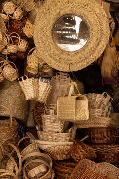 woven rattan baskets mirrors of all shapes sizes for sale in village boutique portugal