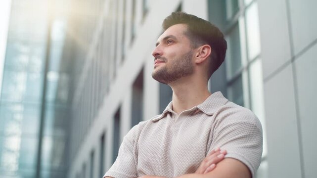 Close up dreamy inspired happy calm Caucasian business man looking away in sunny city downtown positive young male guy dreaming thinking look around businessman professional dream enjoying sun shining