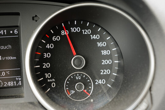 Speedometer in car at 80 km per hour. Close-up of tachometer when driving fast in Germany. Gauge in dashboard displaying the travel speed.