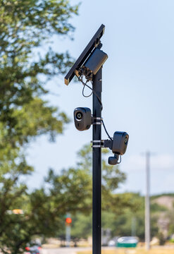 Solar powered automatic license plate reader camera installed on a suburban street pole for traffic monitoring near Georgetown Texas
