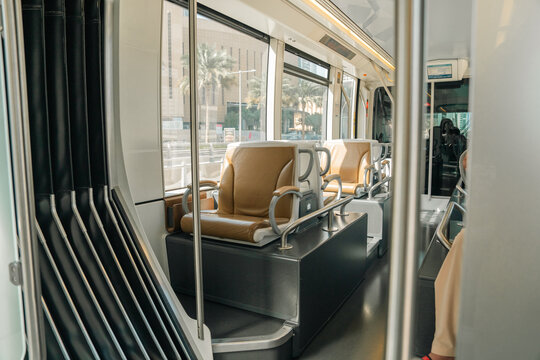 A subway car with people. An empty car.
