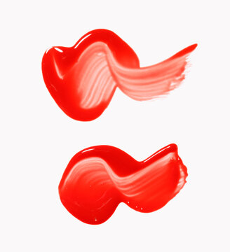 set of two red lip gloss smears, cosmetics beauty product texture, liquid blush, lipstick
