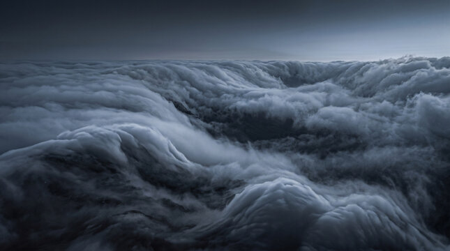 rolling fog waves and atmospheric clouds in dark tones