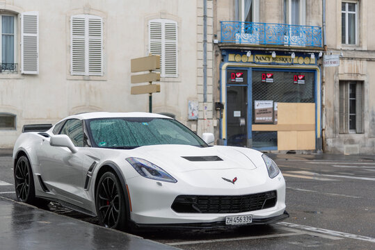 Nancy, France - July 27th 2019 : View on a white Chevrolet Corvette C7 Grand Sport parked on a street under the rain.